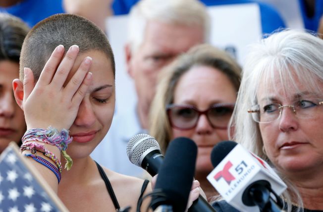 (FILES) In this file photo taken on February 17, 2018 Marjory Stoneman Douglas High School student Emma Gonzalez reacts during her speech at a rally for gun control at the Broward County Federal Courthouse in Fort Lauderdale, Florida. One month to the day after a 19-year-old shooter unleashed a hail of gunfire at a Florida high school, tens of thousands of American students will stage a school walkout in a politically charged tribute to the victims. The "National School Walkout" slated to begin March 14, 2018 at 10:00 am will last 17 minutes -- one for each victim shot dead during the Valentine's Day massacre in Parkland.  / AFP PHOTO / RHONA WISERHONA WISE/AFP/Getty Images
