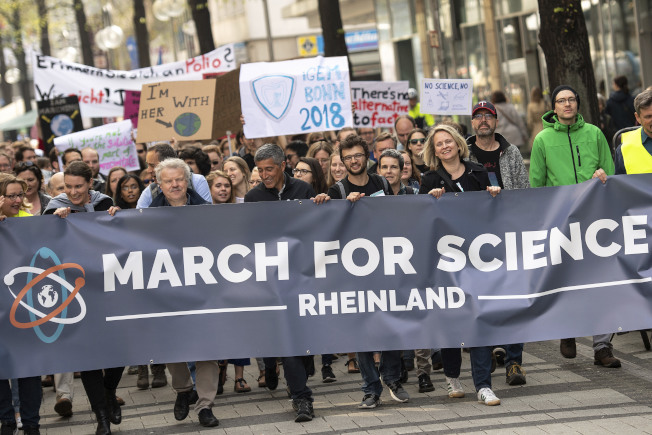 Protesters attend a 'March For Science' in Cologne, Germany, April 14, 2018 to support globally freedom of sience. (Marius Becker/dpa via AP)