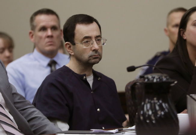 FILE - In this Wednesday, Jan. 24, 2018 file photo, Larry Nassar sits during his sentencing hearing in Lansing, Mich. Nassar, a 54-year-old former doctor for USA Gymnastics and member of Michigan State's sports medicine staff, admitted to molesting athletes while he was supposedly treating them for injuries. Nassar was the U.S. national team’s doctor from 1995 to 2015. (AP Photo/Carlos Osorio, File)