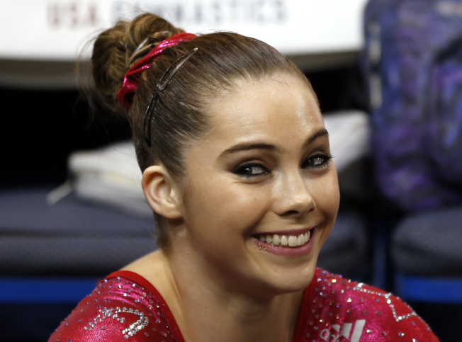 FILE - In this Aug. 17, 2013 file photo McKayla Maroney smiles after competing on the floor exercise during the U.S. women's national gymnastics championships in Hartford, Conn. Maroney says the group that trains U.S. Olympic gymnasts forced her to sign a confidential settlement to keep allegations of sexual abuse by the team's doctor secret. Maroney filed a lawsuit Wednesday, Dec. 20, 2017, in Los Angeles, against the United States Olympic Committee and USA Gymnastics. The suit also seeks damages from Michigan State University, where the team's doctor, Larry Nassar, worked for decades. (AP Photo/Elise Amendola,File)