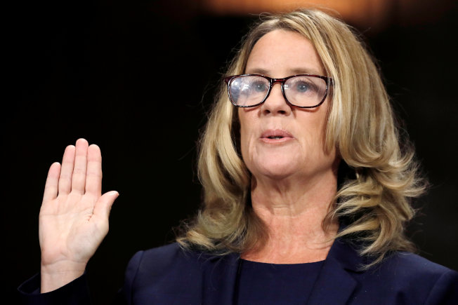 Professor Christine Blasey Ford, who accused U.S. Supreme Court nominee Brett Kavanaugh of a sexual assault in 1982, is sworn in to testify before a Senate Judiciary Committee confirmation hearing for Kavanaugh on Capitol Hill in Washington, U.S., September 27, 2018. REUTERS/Jim Bourg TPX IMAGES OF THE DAY