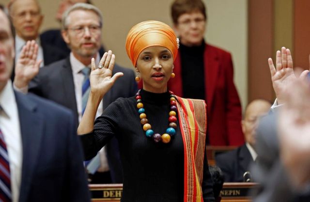 State Rep. Ilhan Omar takes the oath of office as the 2017